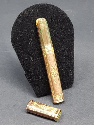a pen and a lighter on a display stand