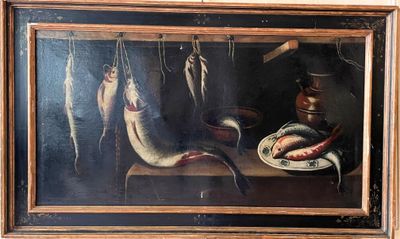 a picture of a painting of fish hanging on a line