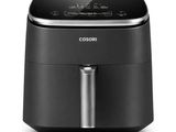 a black and silver air fryer sitting on top of a white surface