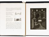 an open book with a picture of a man in a chair