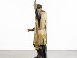 an image of a statue of a man with a sword in his hand