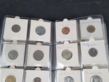 a lot of different types of coins in the box