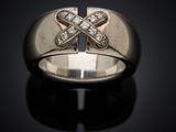 a close up of a ring with a cross on it