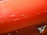 a red suitcase that is sitting on the floor