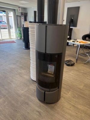 a stove in the middle of a room in a building