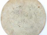 a white plate that has a brown design on it