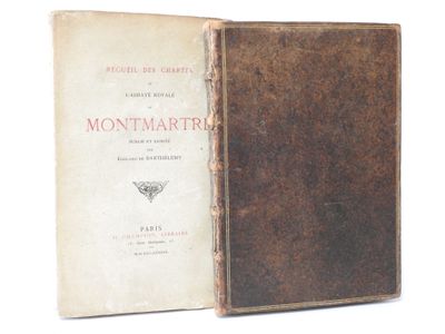 an old book with a brown cover sitting on top of a white surface