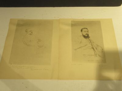 two drawings of a man and a woman on a table