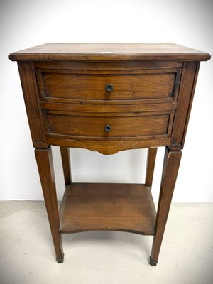 an old wooden table with a drawer on top of it