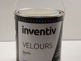a can of paint sitting on a table with a white background