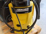 a yellow machine that is sitting on a pallet