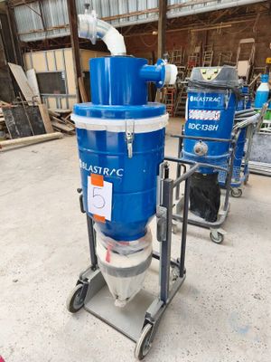a blue machine that is sitting on a cart