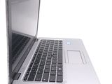 a close up of a laptop computer on a white surface