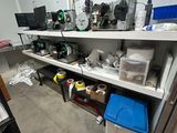 a room with a lot of clutter on the shelves