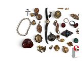 many different types of jewelry on a white surface