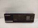 a black box with a bluetooth keyboard inside of it