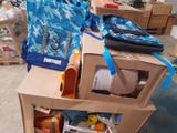 a cardboard box with a backpack on top of it
