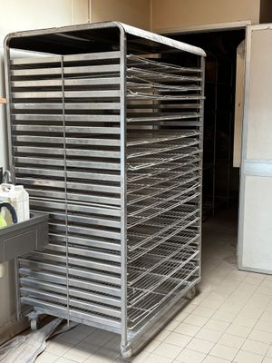 an image of a kitchen with a rack of food in it