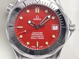 a red watch with a black face on a white surface