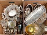 two boxes that have silverware in them on a table