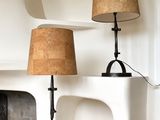 two lamps that are sitting on a table in a room