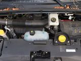 a picture of a car engine with its hood open