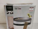 the box is open to show the contents of a crock cooker