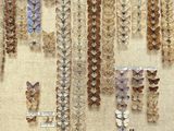 many different types of butterflies on display in a display case