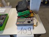 a table with a lot of electrical equipment on top of it