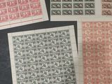 several different types of stamps are displayed on a table