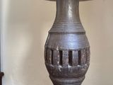 a lamp that is sitting on top of a wooden table