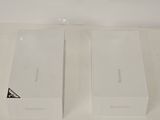 two white boxes that are sitting on a table