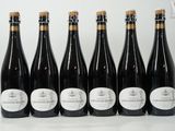 six bottles of wine lined up in a row on a table