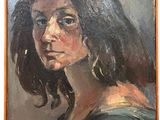 an oil painting of a woman ' s face in a brown frame