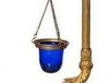 a gold and blue scale with a chain hanging from it
