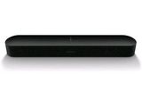 a close up of a black speaker on a white surface
