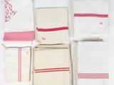 several different types of towels are laid out on a white surface