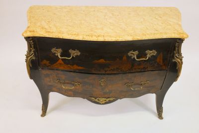 an antique chest of drawers with marble top and brass handles