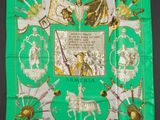 green silk scarf with a picture of a man on a horse and other items