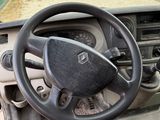 dashboard of a car with a steering wheel and dashboard sticker