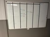 a white board on the wall in a room