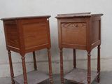 two wooden tables that are next to each other