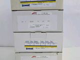 three boxes with labels on them are stacked on top of each other