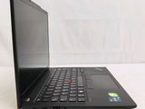 a black laptop with a red button on the screen