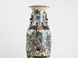 a vase that is sitting on a white surface