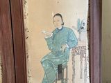 a painting of a man sitting on a chair in front of a table