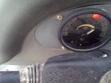 a close up of a speedometer on the dashboard of a motorcycle