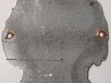 a piece of metal that has a face on it