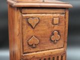 an image of a wooden box with hearts and spades on it