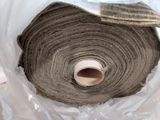 a roll of carpet that is wrapped in a plastic bag